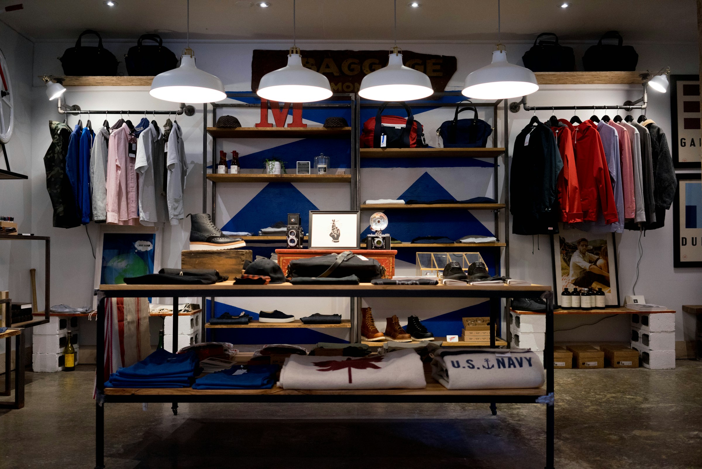 Retail store with illuminated merchandise displays and pendant lighting