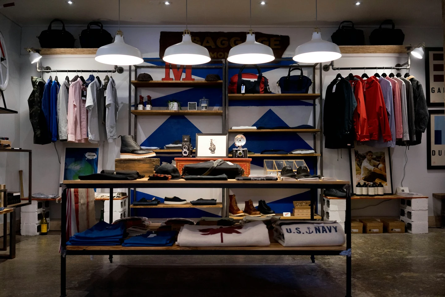 Retail store with illuminated merchandise displays and pendant lighting